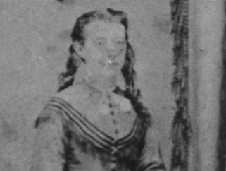 A person in a dress

Description automatically generated